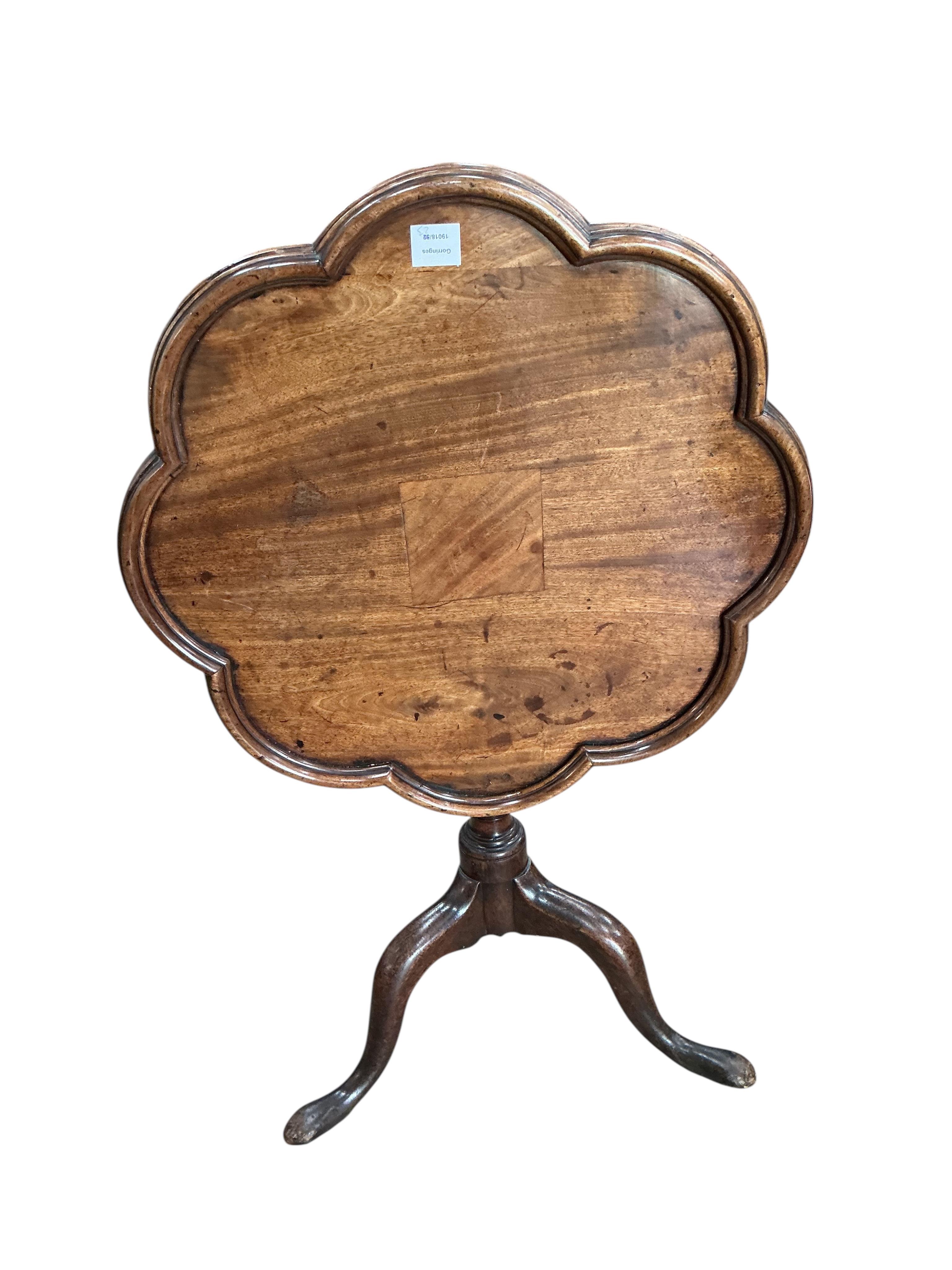 A George III mahogany circular tilt top tripod tea table, altered, diameter 64cm, height 69cm